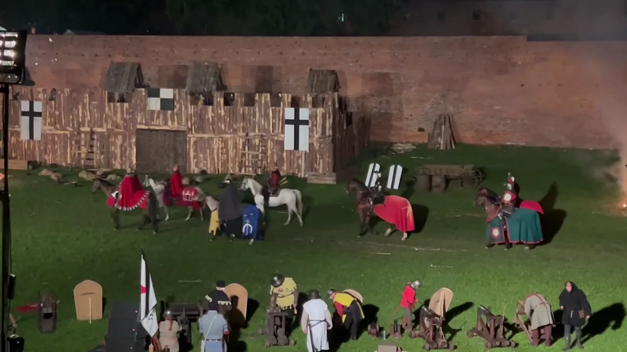 Mounted reenactors performing a night siege at Malbork