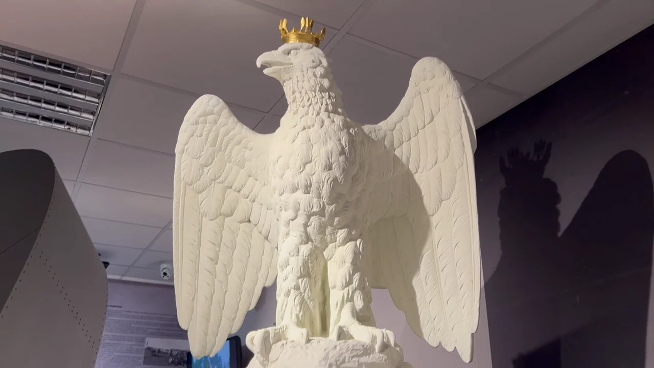 White eagle sculpture with a crown
