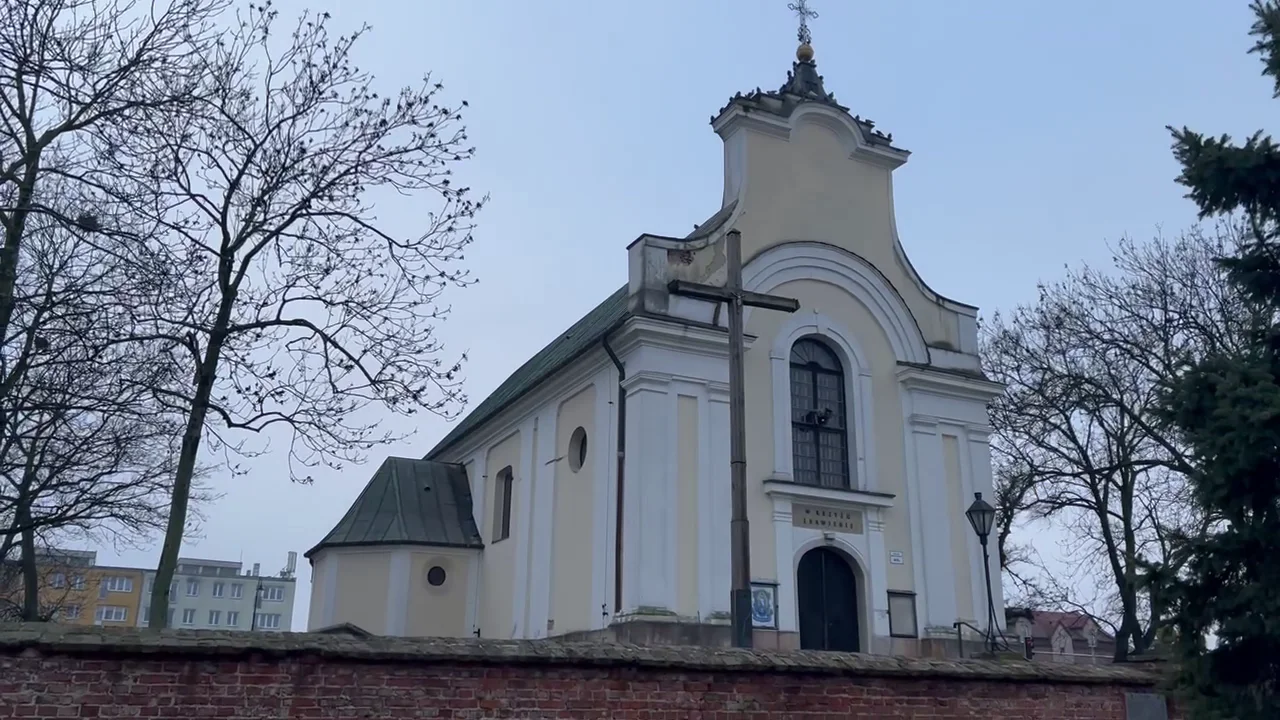 A church in Góra Kalwaria within the everyday setting of the local community.