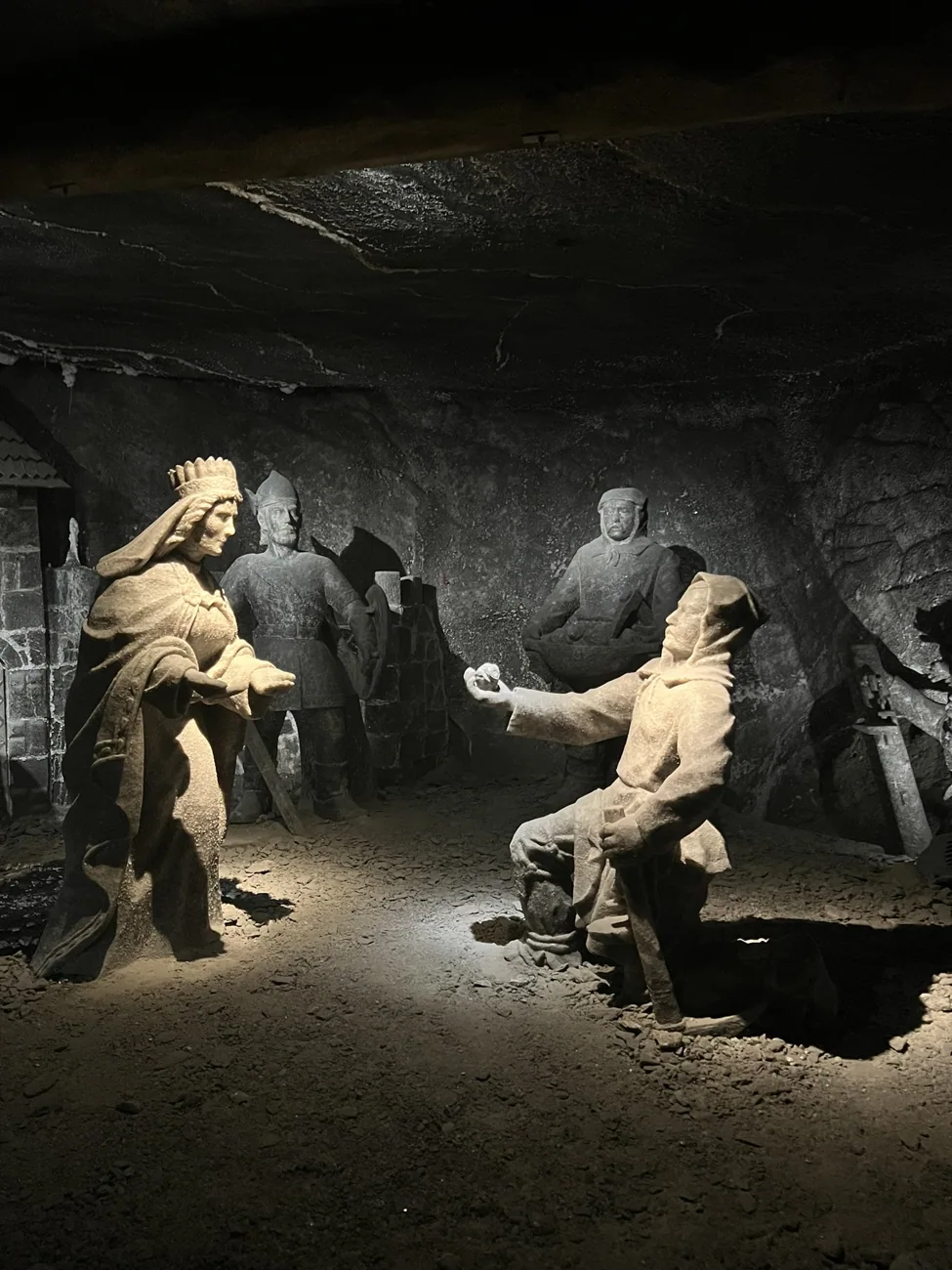Sculpture at Wieliczka apparently showing a miner presenting Saint Kinga with her ring