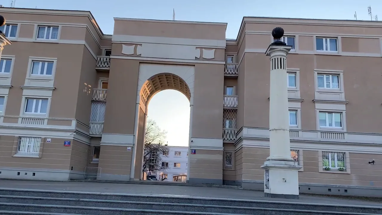 A monumental archway in the post-war Muranów residential estate