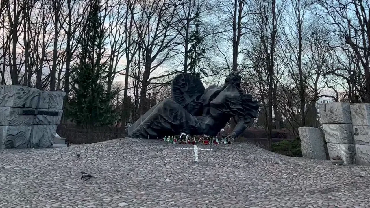 Original photograph of Gustaw Zemła’s <em>Polegli–Niepokonani</em> stands on the mound containing the a at Warsaw Insurgents Cemetery