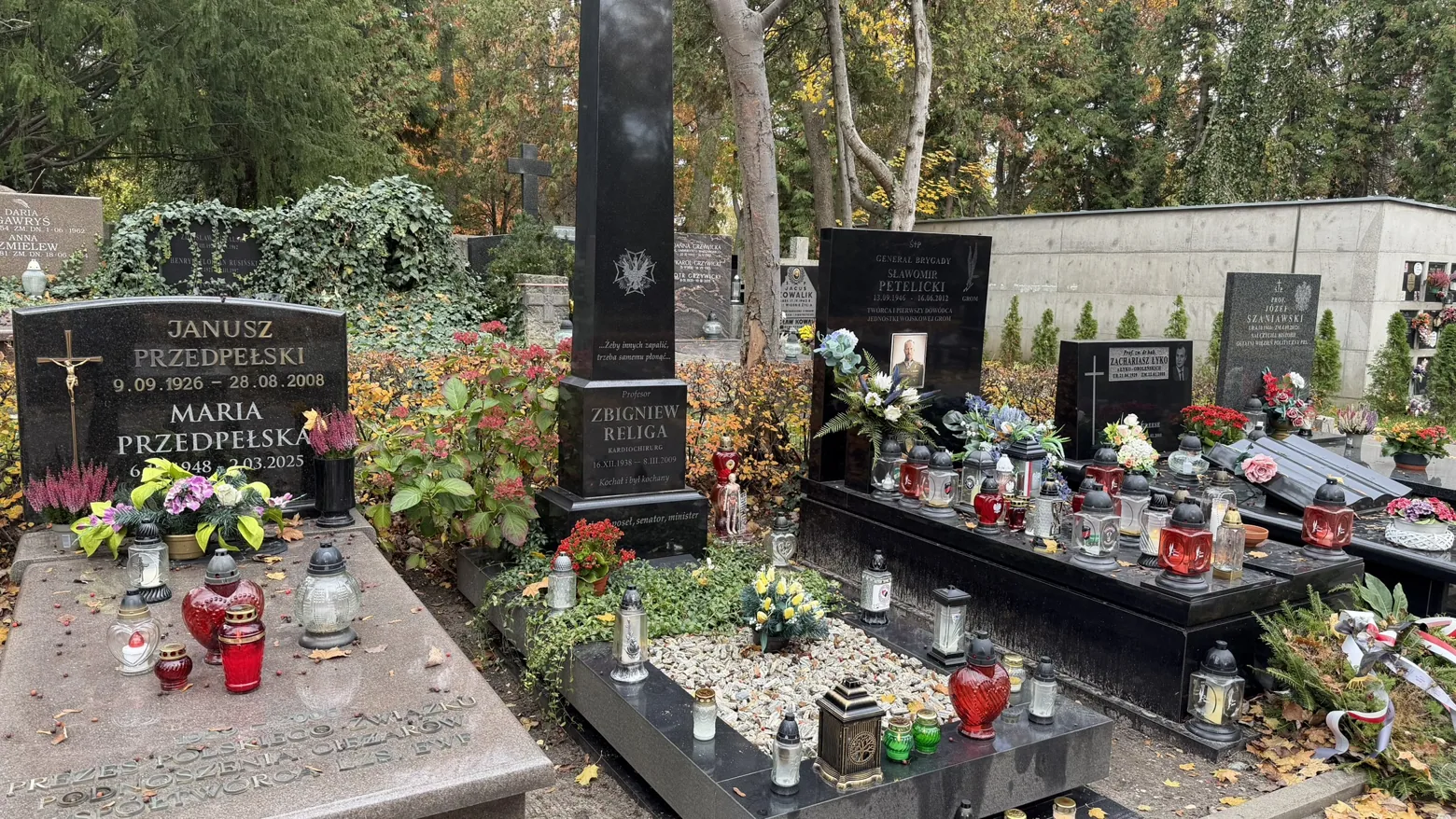 The grave of cardiac surgeon Zbigniew Religa, marked by a tall black monument.