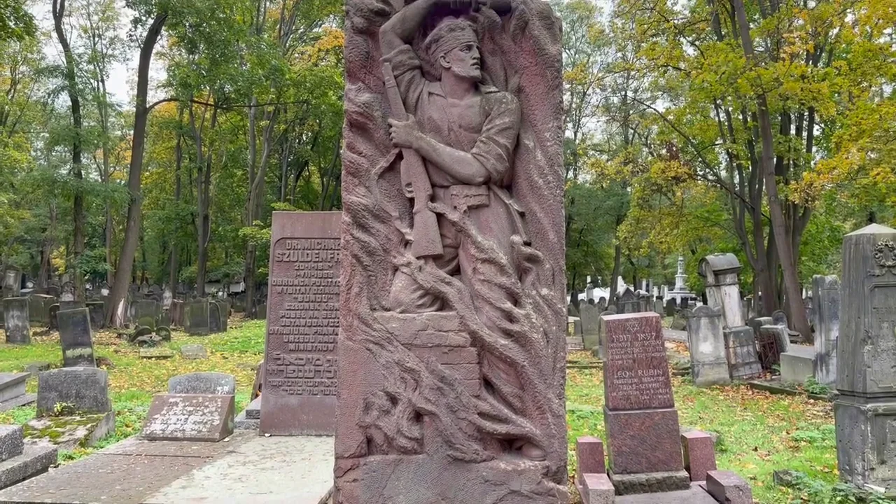 Stone relief of an armed Jewish fighter at the memorial to Bundist participants in the 1943 Warsaw Ghetto Uprising, Okopowa Cemetery