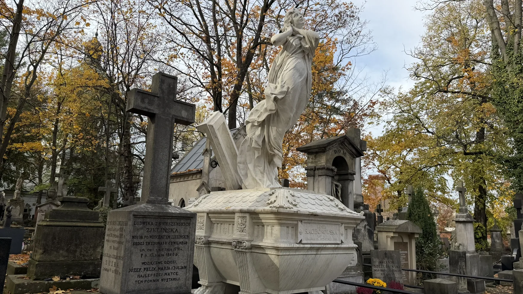 Ornate funerary sculpture photographed in Old Powązki
