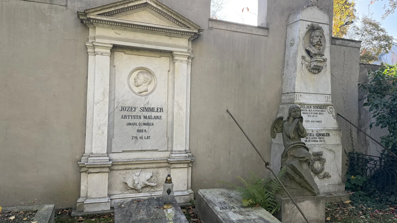 Historic stone plaques and decorative family memorials in the Reformed cemetery.