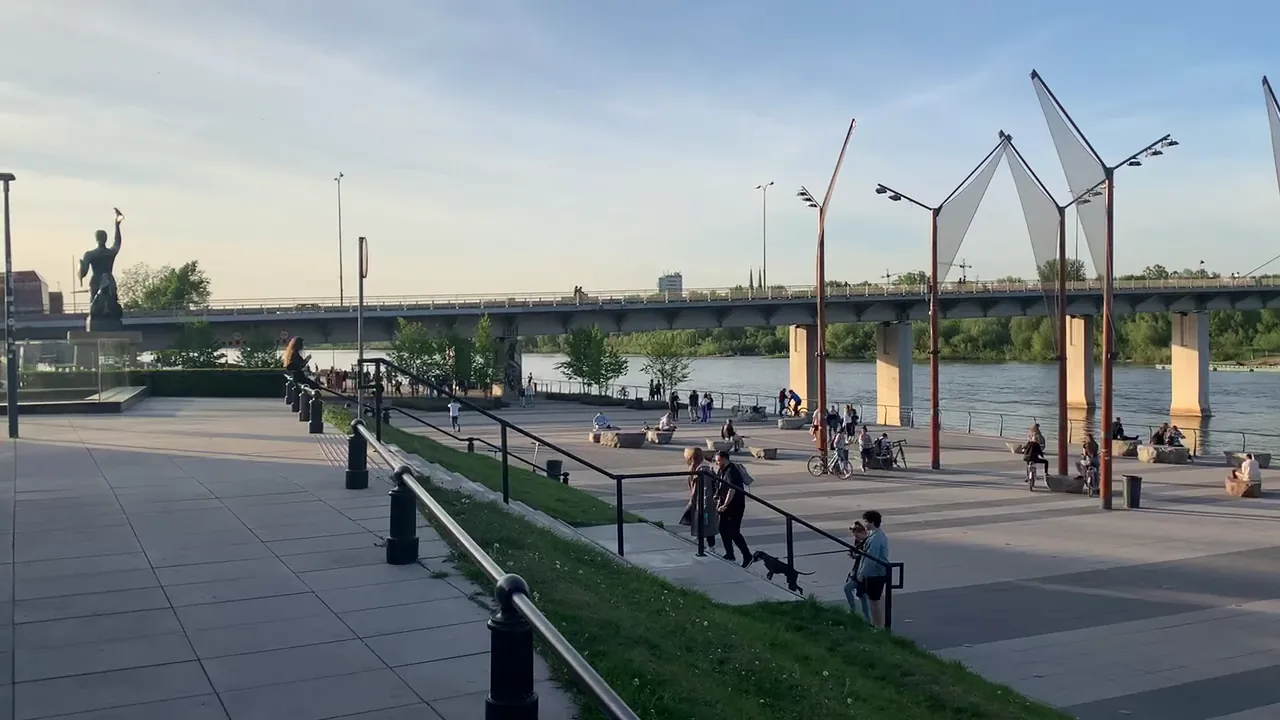 Warsaw Mermaid with sword and shield beside the Vistula river