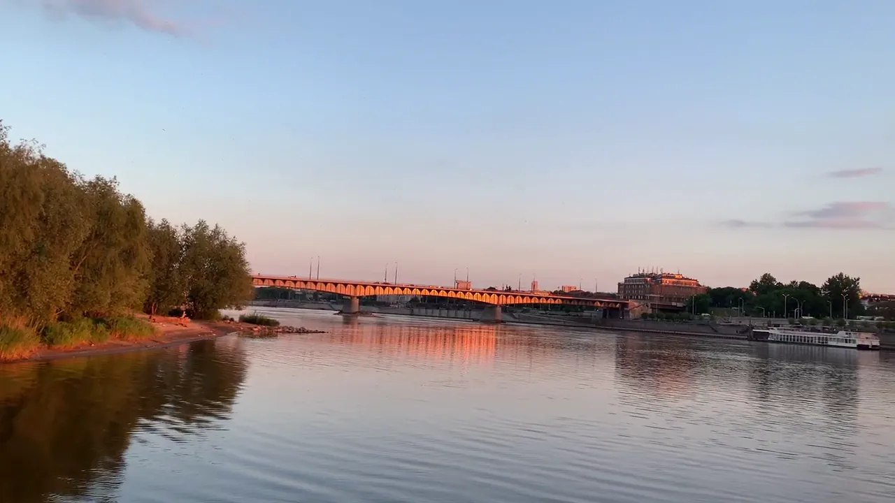 Poniatowski Bridge in warm sunset light above the Vistula